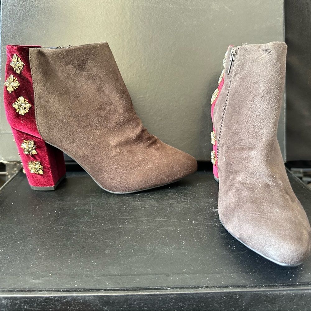 Black and burgundy suede ankle boots with rhinestone starburst details